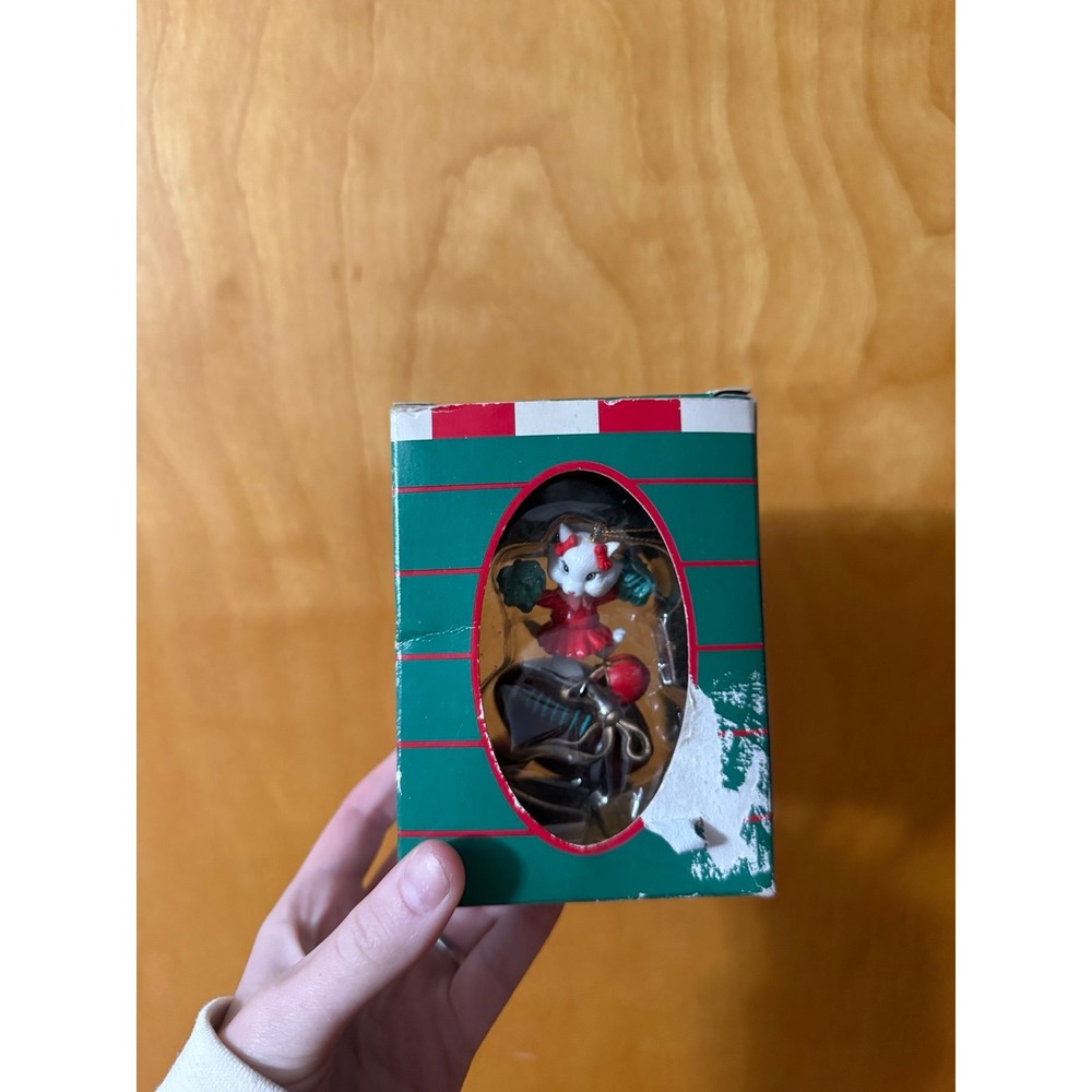 Vintage cheerleader cat on a football Christmas ornament